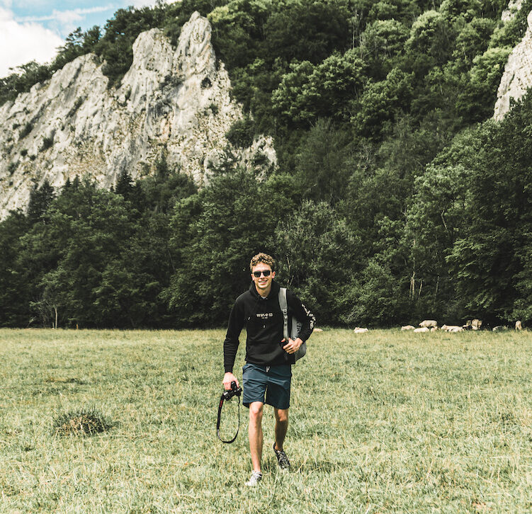 Pieter De Malsche exploring Dinant and walking next to river the Lesse